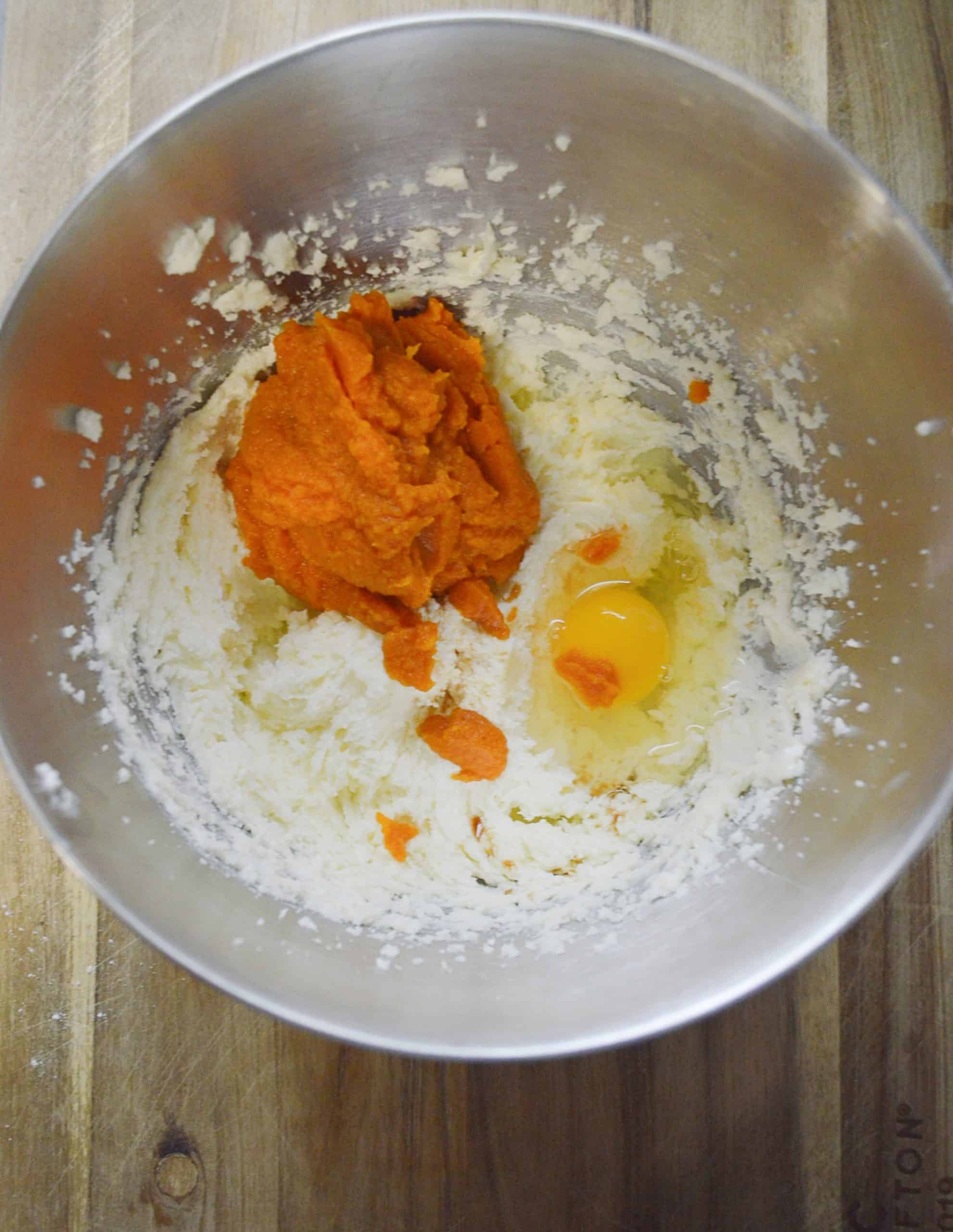 pumpkin puree and egg in mixing bowl