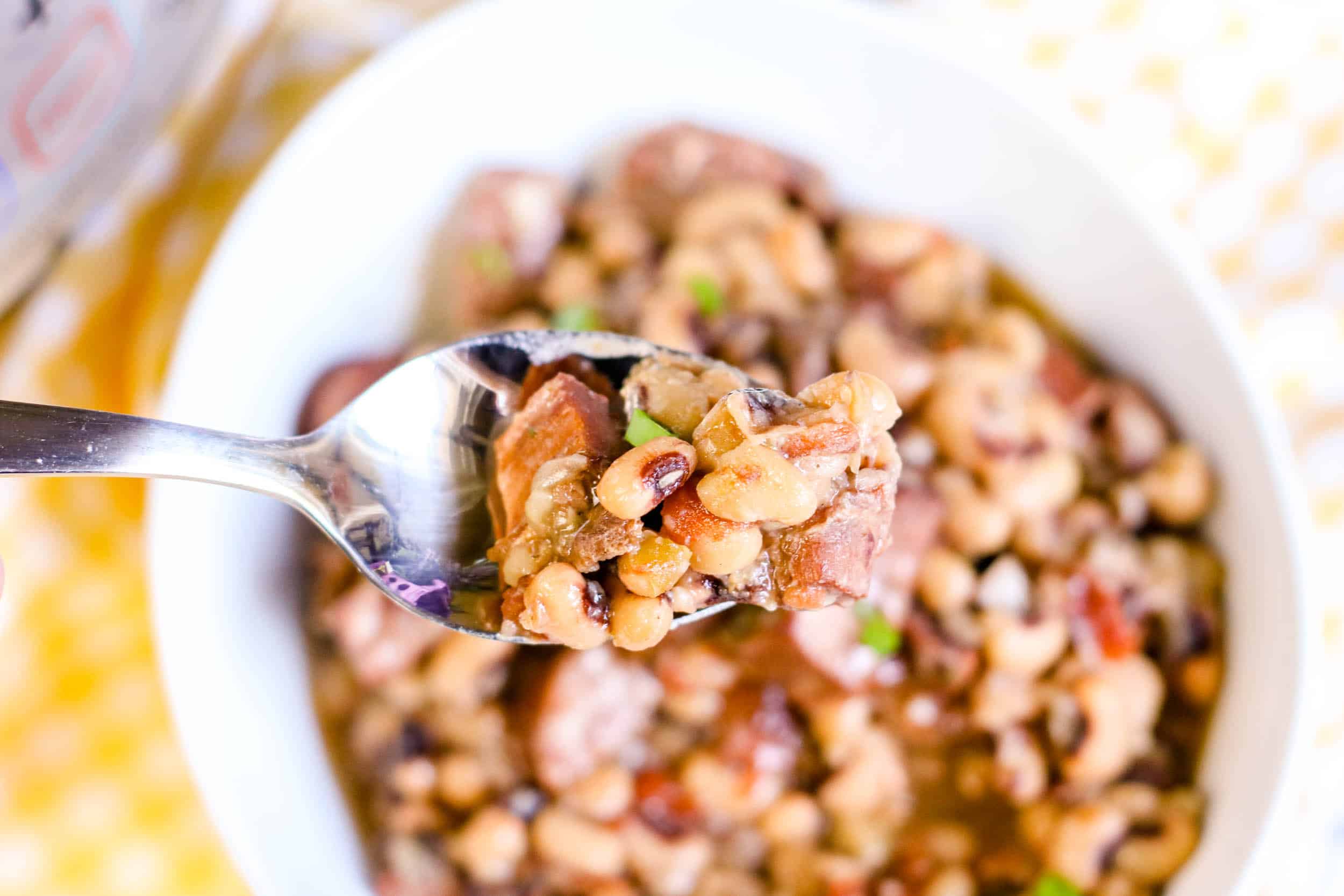 Instant Pot Spicy Black Eyed Peas with Sausage on spoon