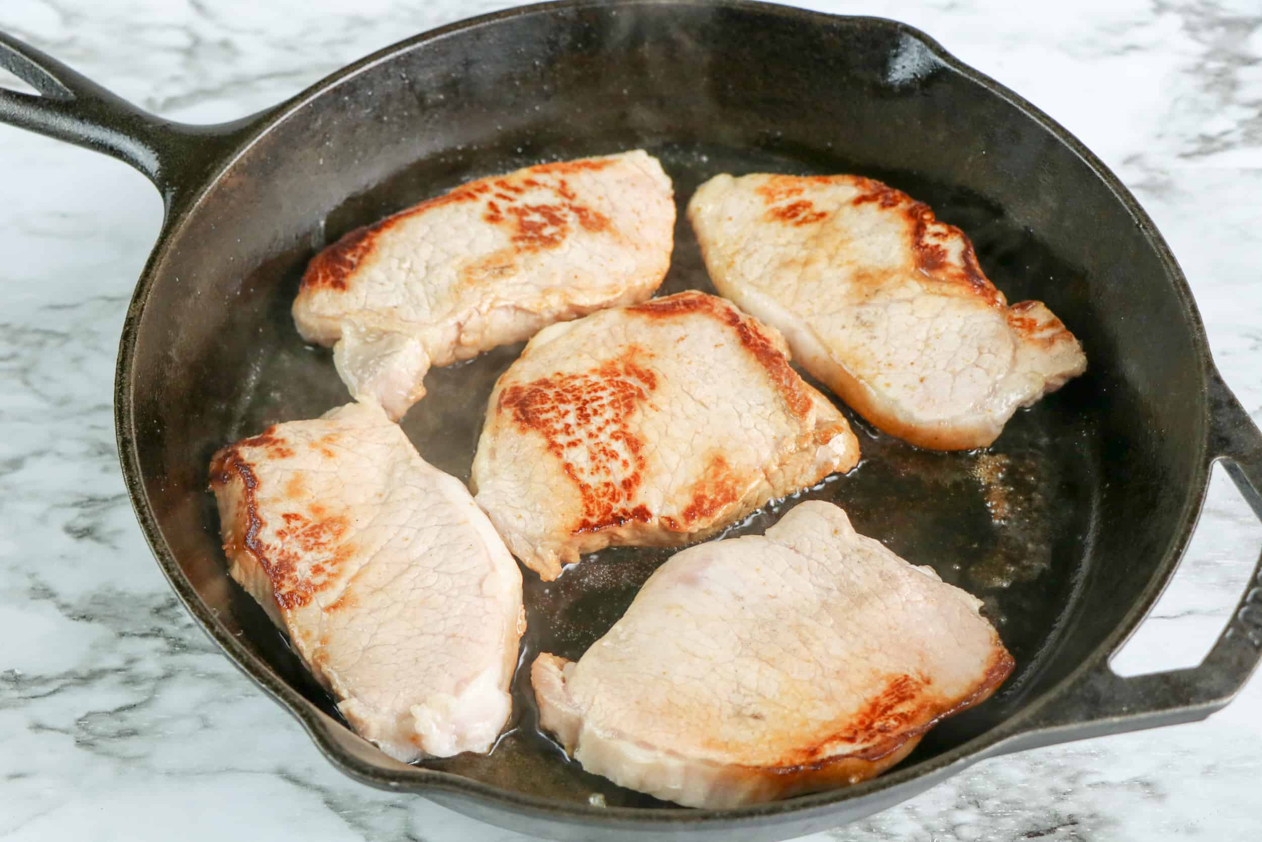 pork chops frying