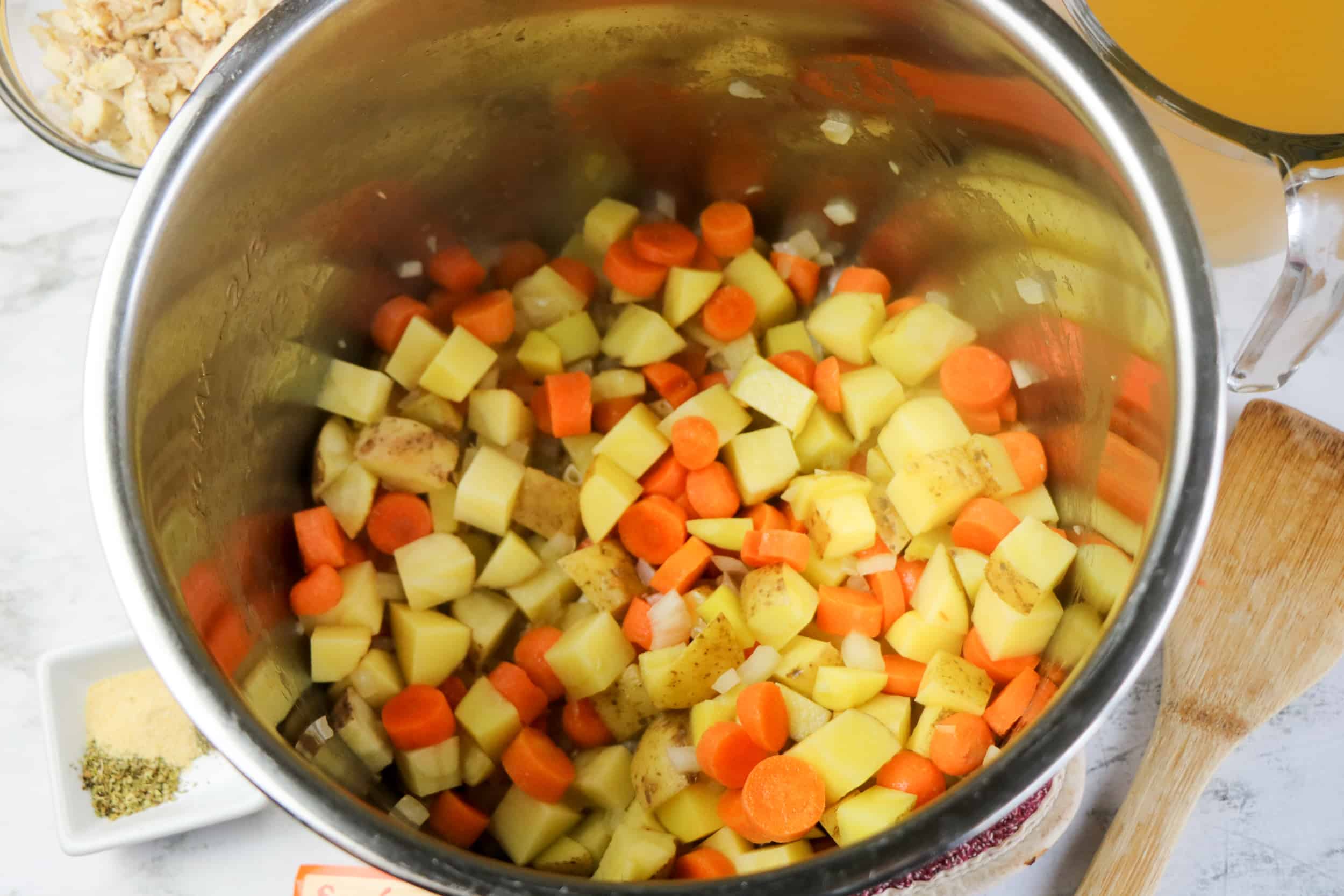 potatoes, carrots, onions in pot