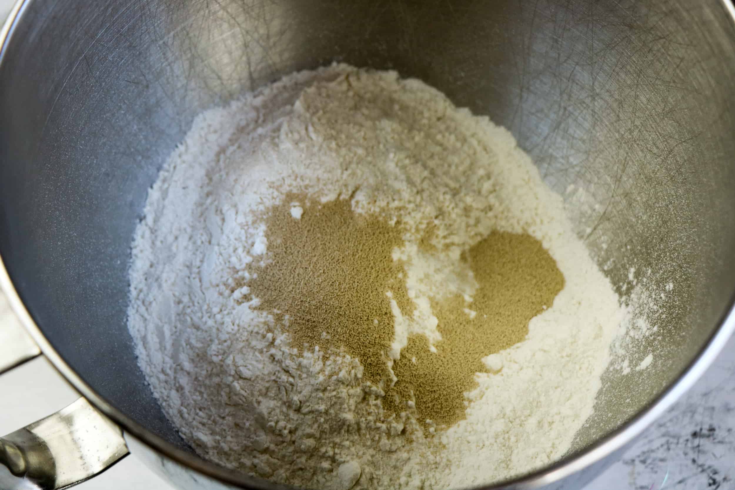 flour and yeast in mixing bowl