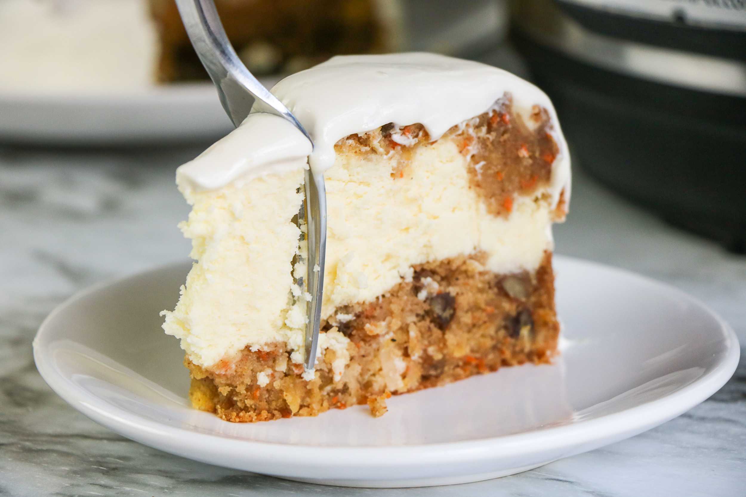 Slice of Instant Pot Carrot Cake Cheesecake on plate