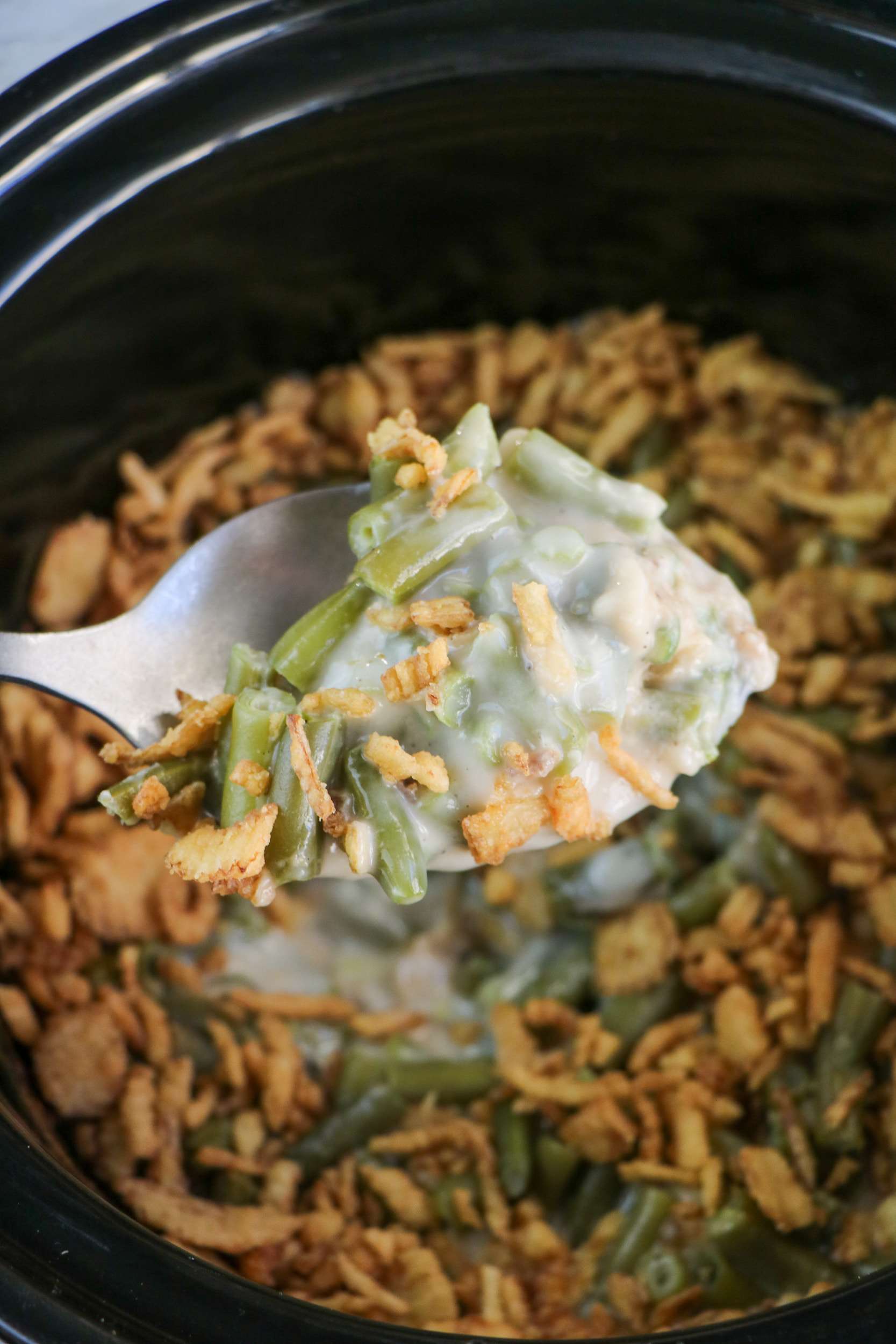 spoon of Slow Cooker Green Beans Casserole