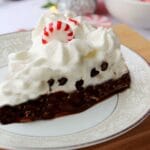 close up image of a slice of candy cane pie on a small plate