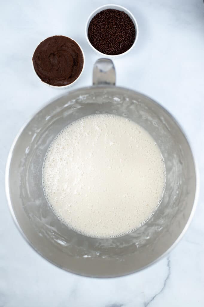 Powdered sugar,, milk and vanilla in a mixing bowl