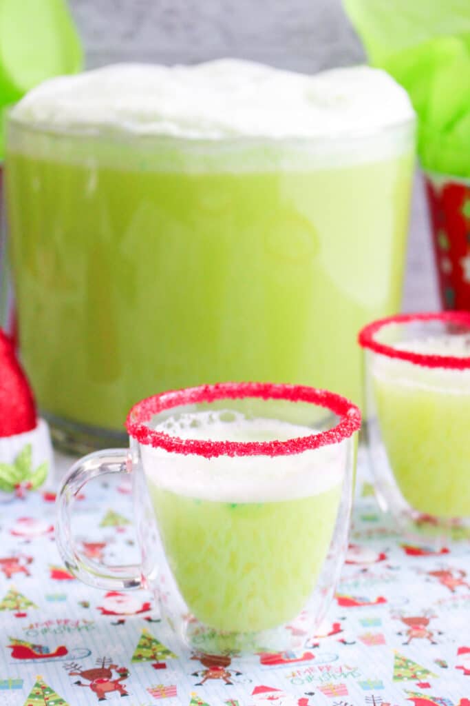 Close up of a clear mug full of green grinch punch