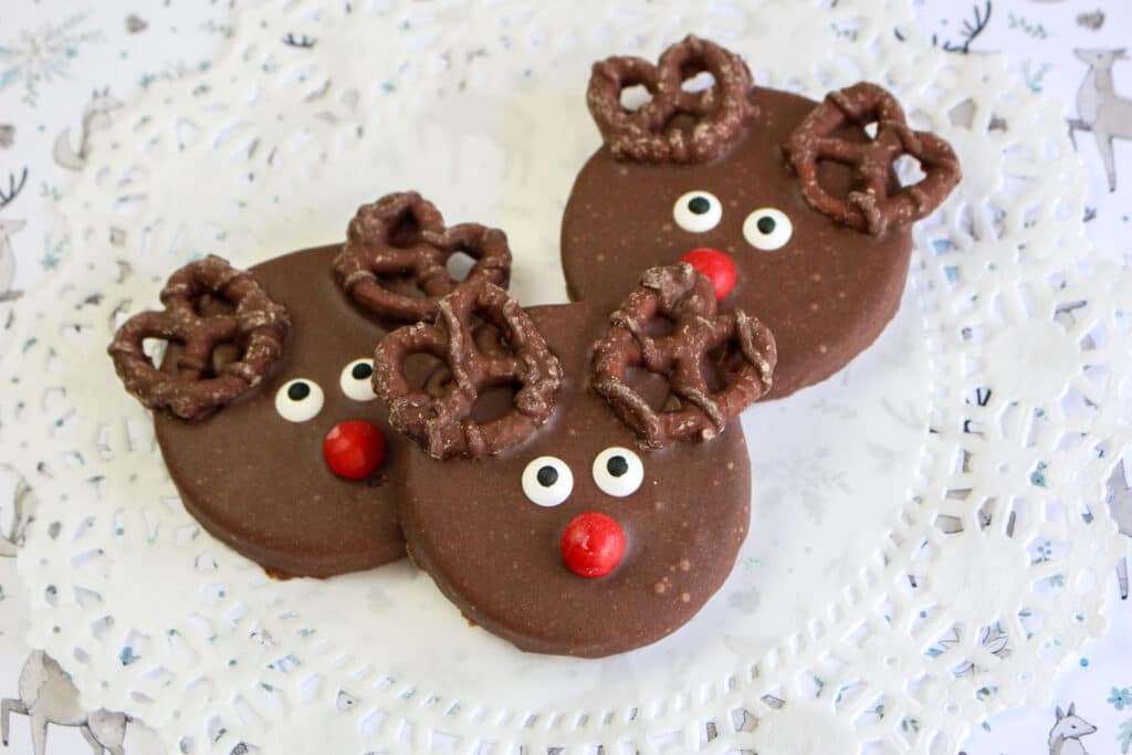 three reindeer cookies slightly stacked on top of one another.