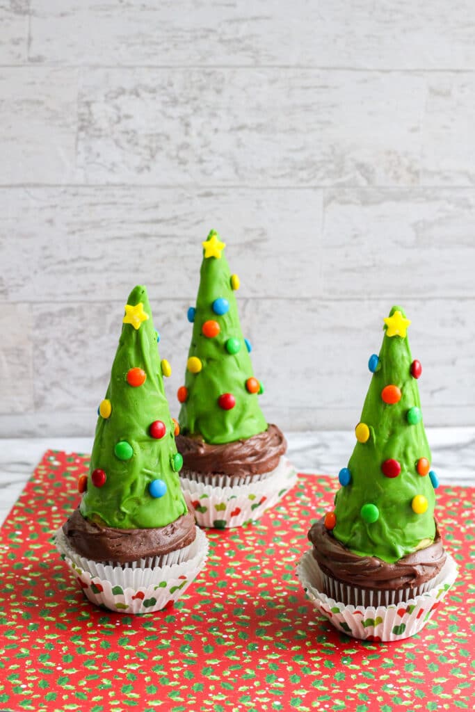 vertical image of three Chocolate Christmas Tree Cupcakes