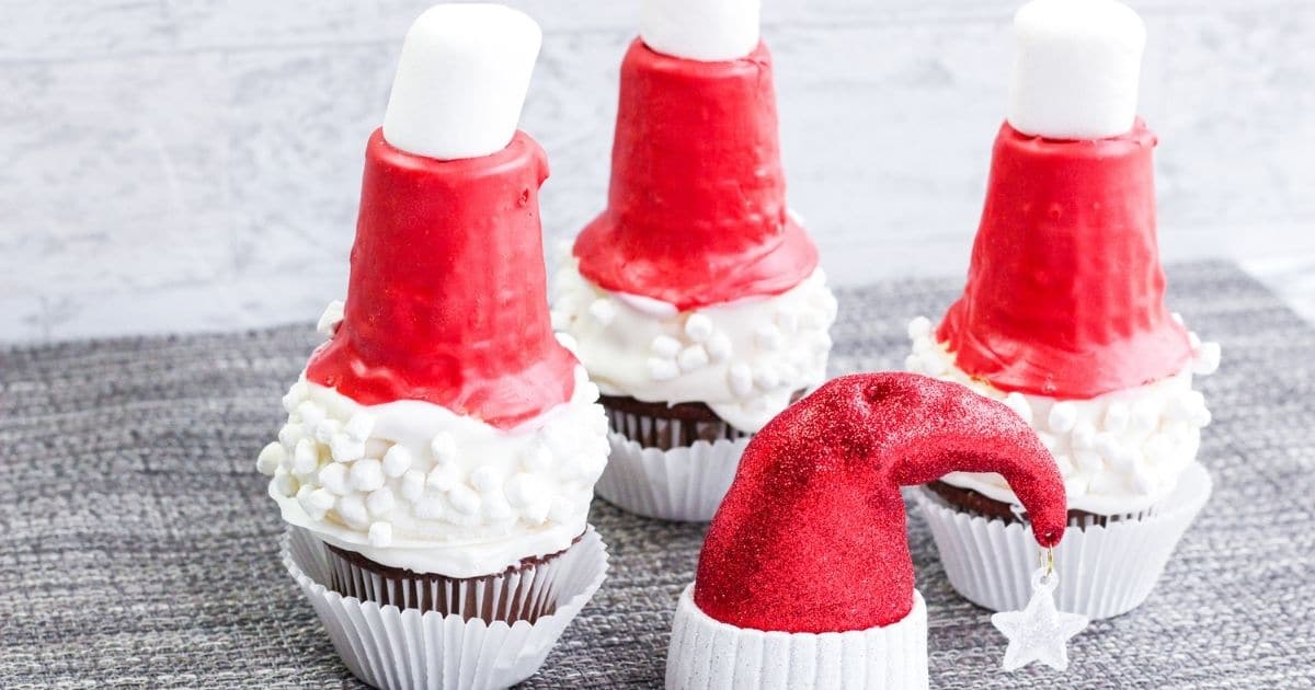 rectangel image sized for facebook of three santa hat cupcakes