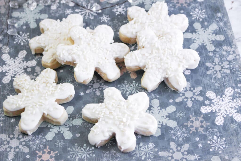 horizontal image of finished snowflake cookies