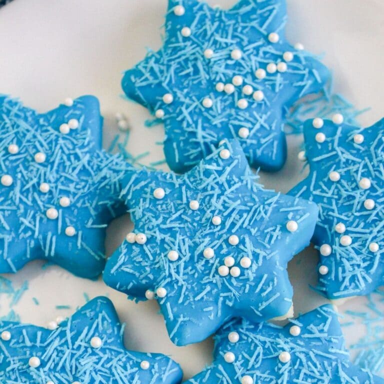 square featured image of star cookies on a white plate