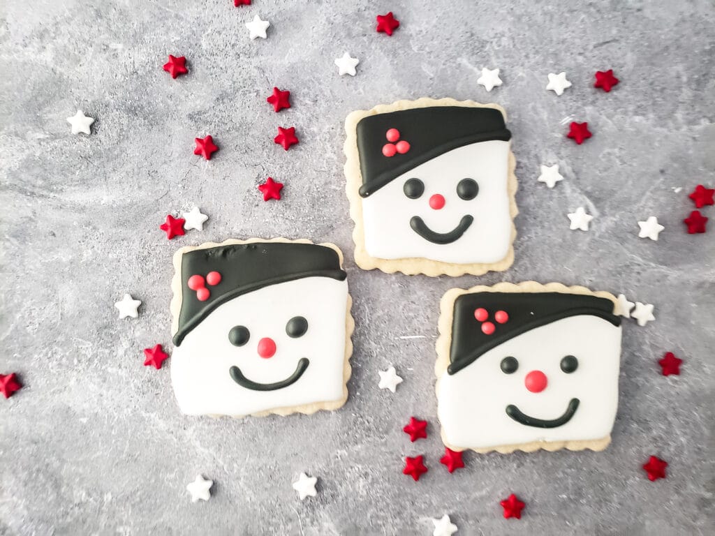 snowman sugar cookies topped with royal icing