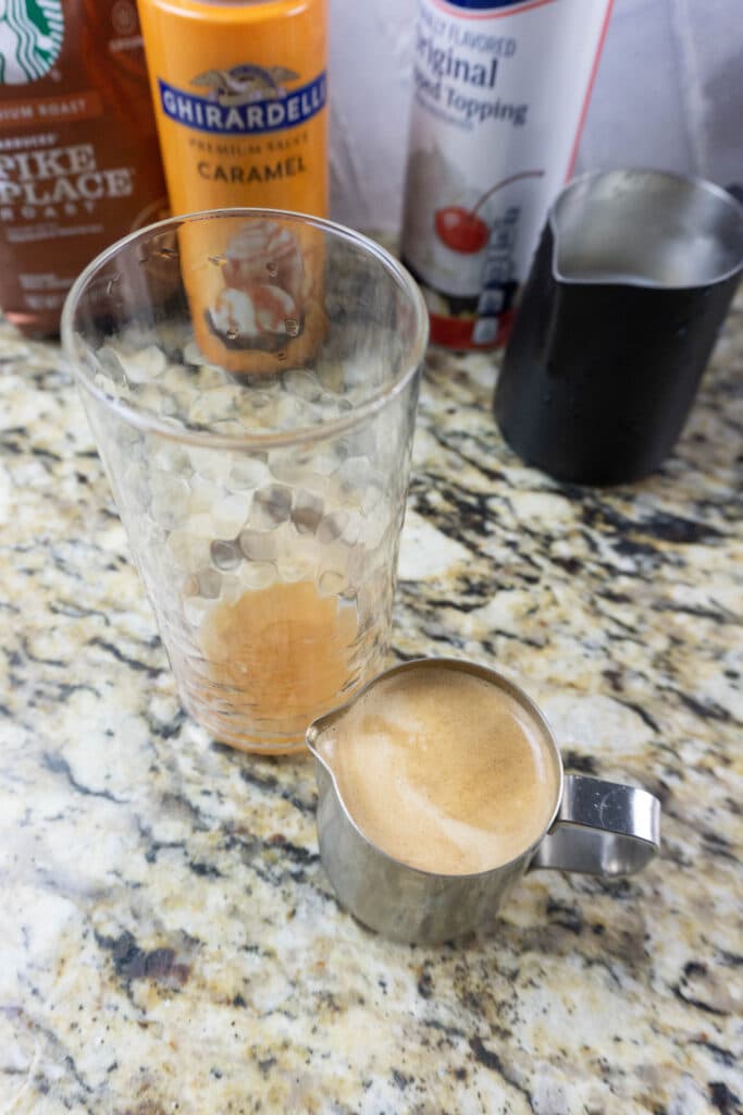 brewed latte in a metal serving cup