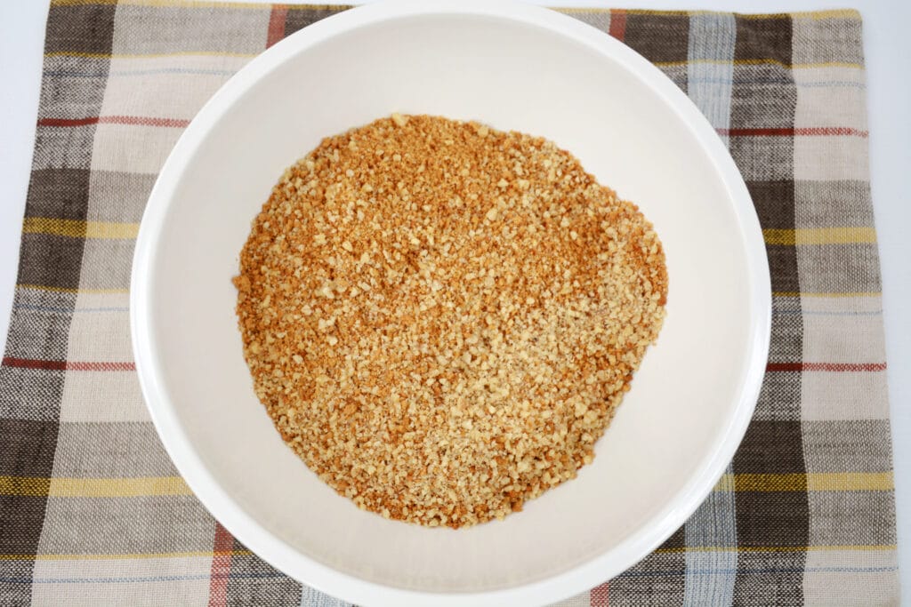 crushed gingersnaps in a white mixing bowl