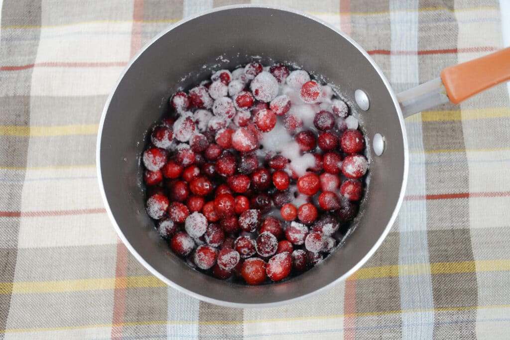 whole cranberries and sugar in a saucepan