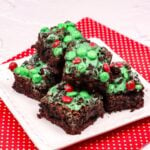 Grinch Brownies stacked on a white plate sized for fb