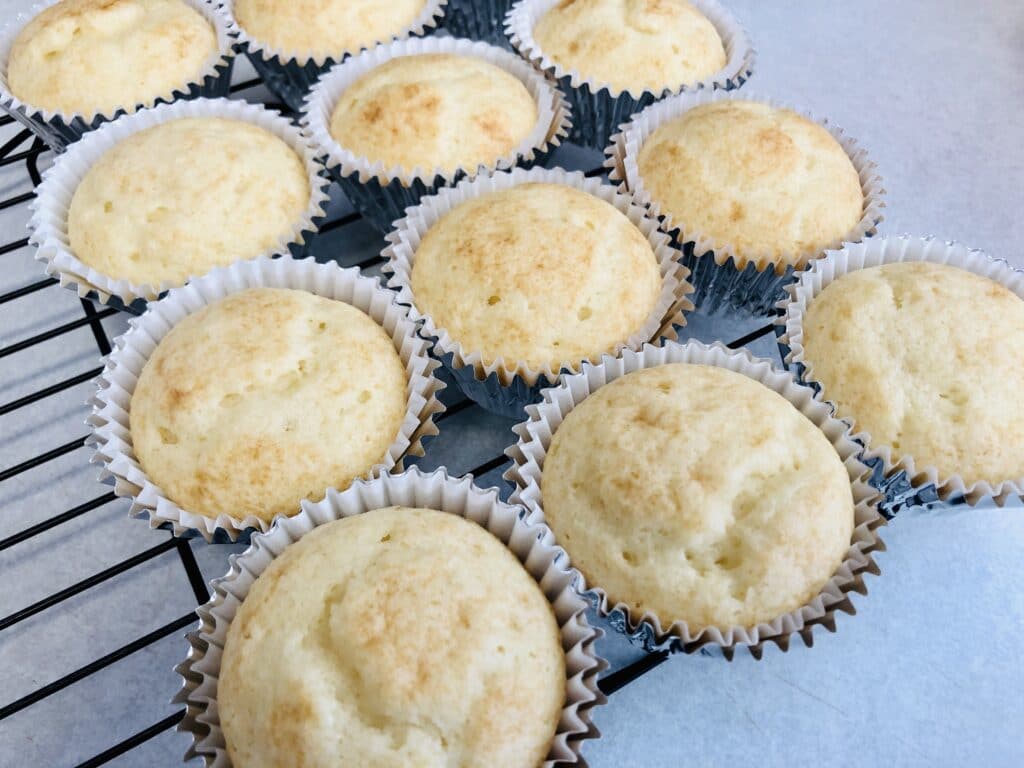baked cupcakes unfrosted on a cooling rack