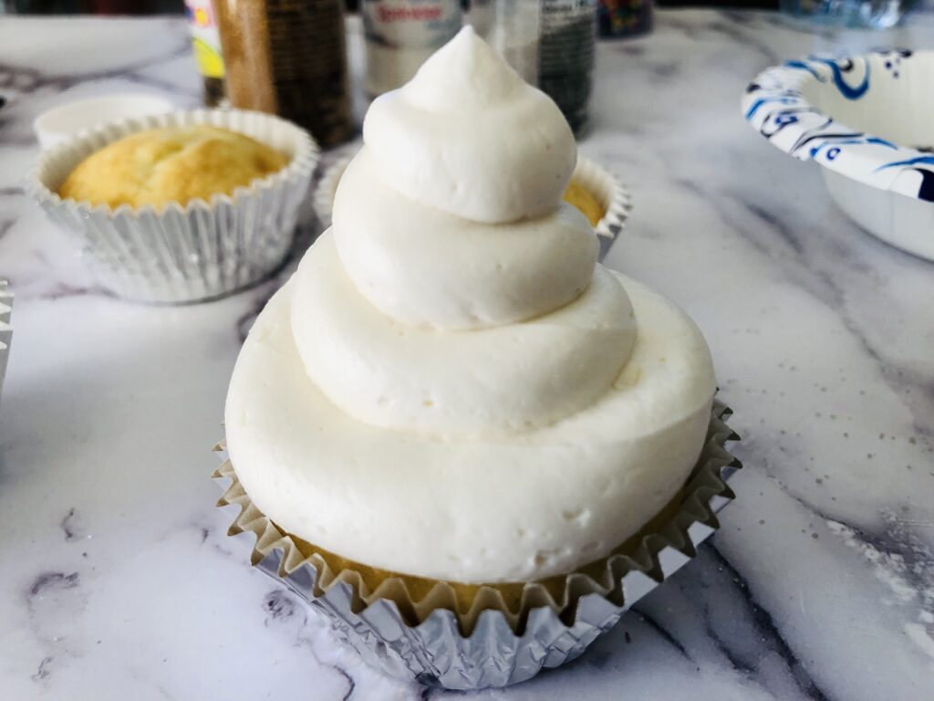 cupcake topped with a swirl of buttercream frosting