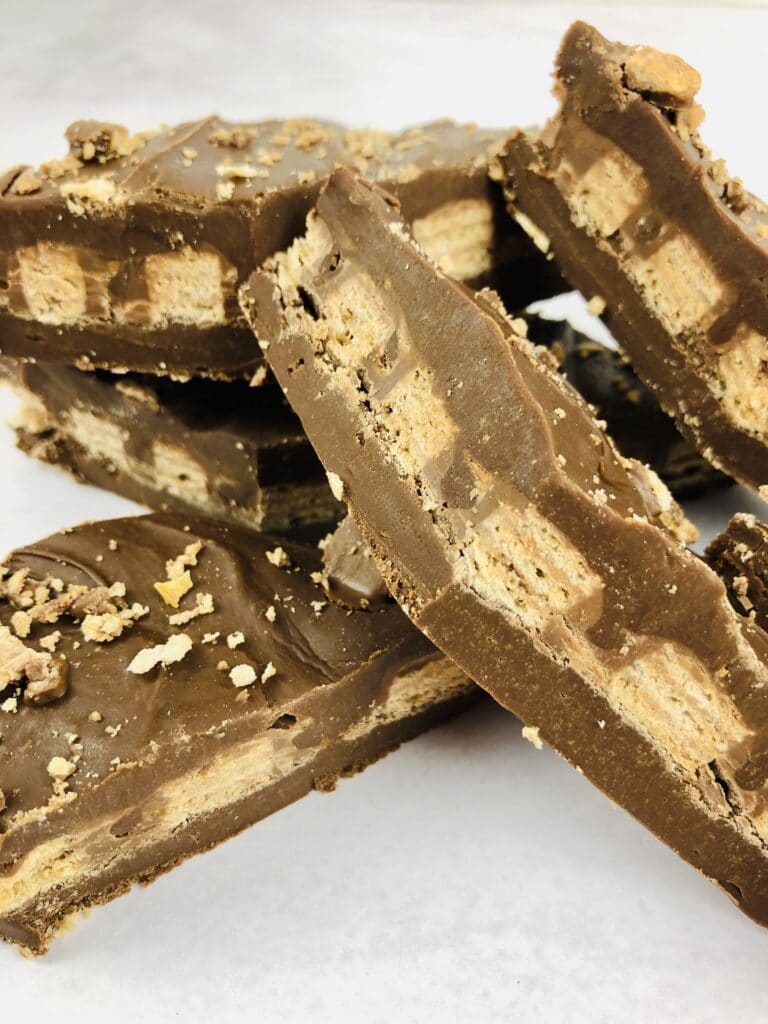 close up vertical image of a Kit Kat Fudge on a white table