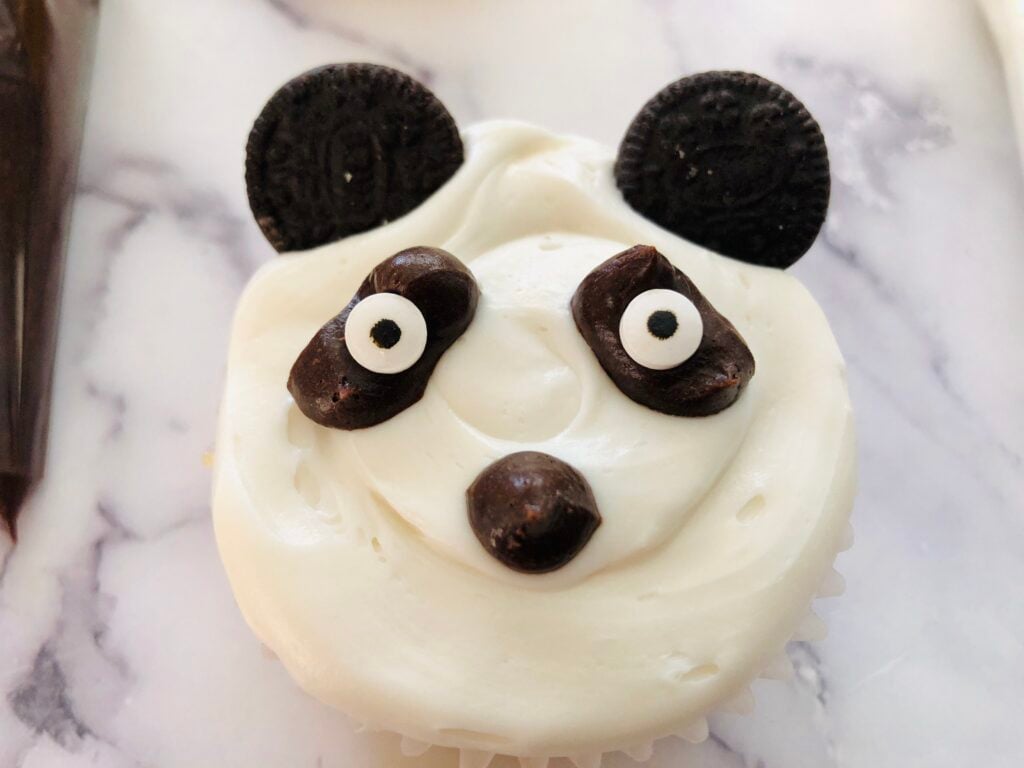 Finished Panda Cupcake on a white marble counter