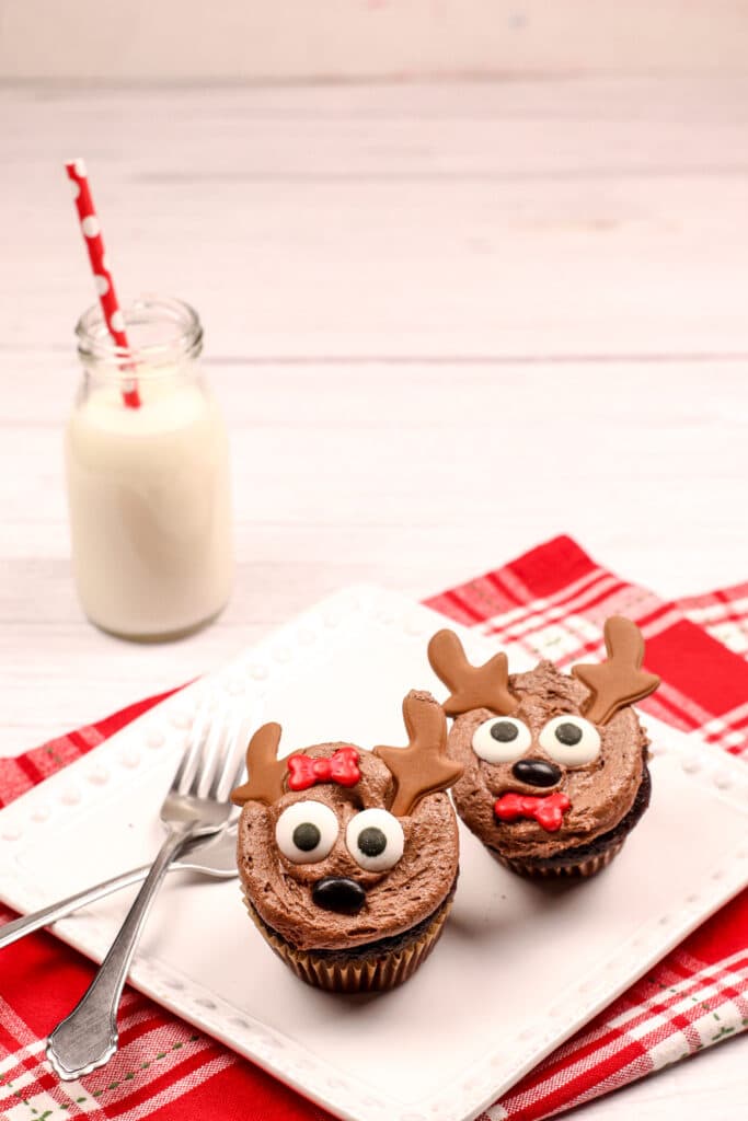 Reindeer Cupcakes with chocolate antlers on a square white plate Reindeer Cupcakes with chocolate antlers on a square white plate