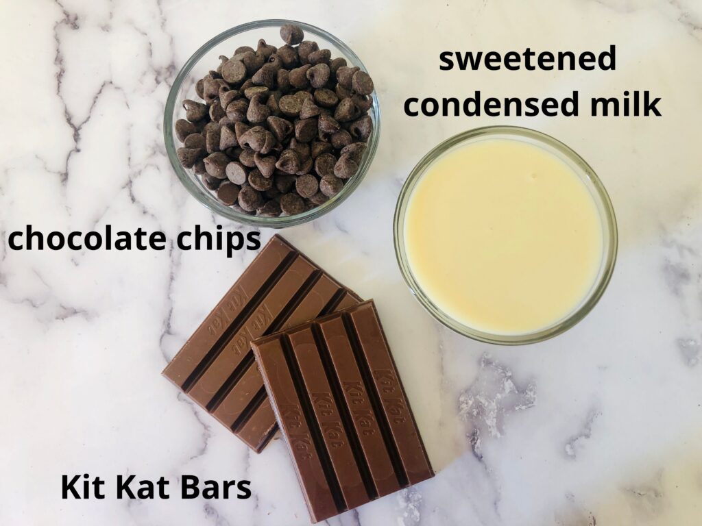 ingredients for kit kat fudge on a marble counter top