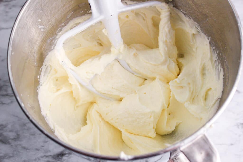 cremaed butter and sugar in a metal mixing bowl