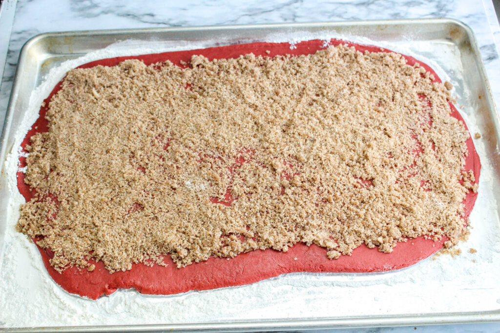 red velvet dough topped with cinnamon sugar mixture