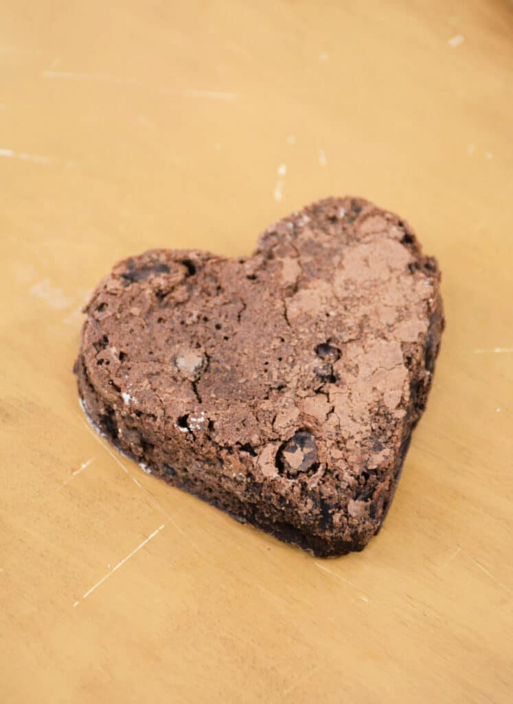 heart shaped brownie on a wooden table