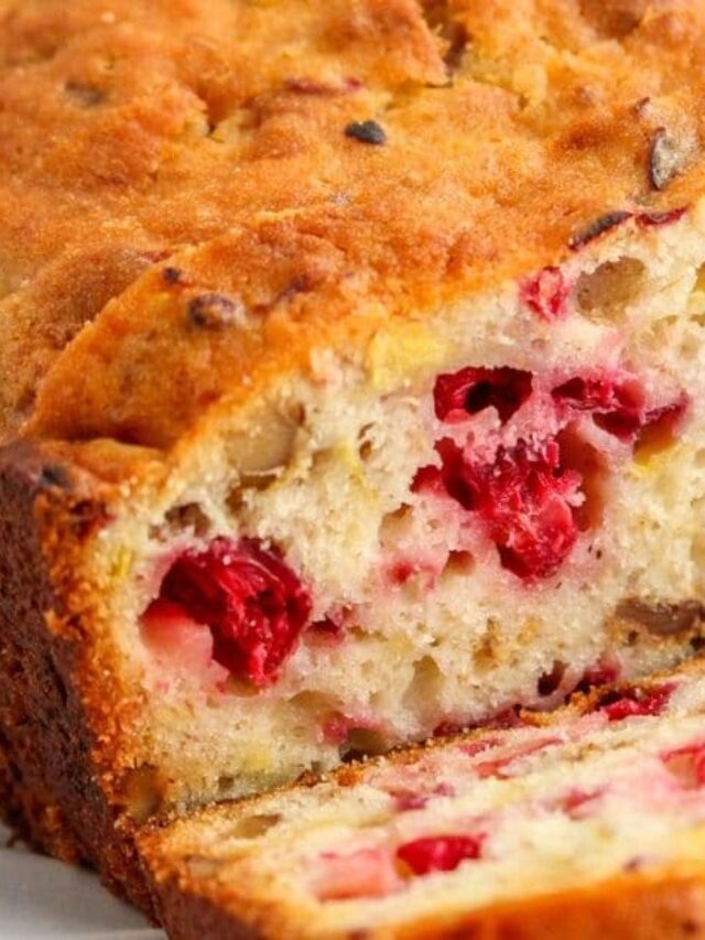 rectangle image of cranberry walnut banana bread with a slice cut open
