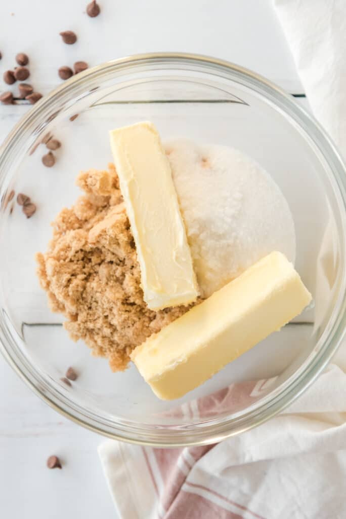 butter and sugar in a glass mixing bowl