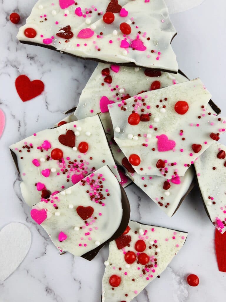 Vertical image of valentines bark broken in pieces on a marble counter