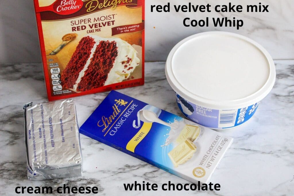 ingredients for red velvet cake mix on a marble backdrop