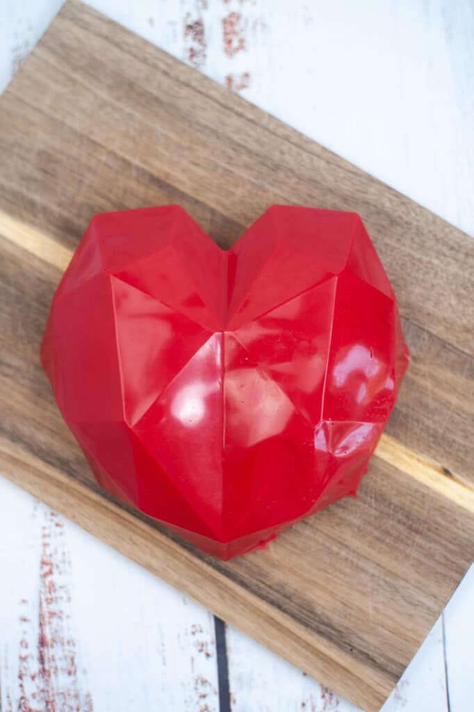 hardened smashable heart on a wooden cutting board