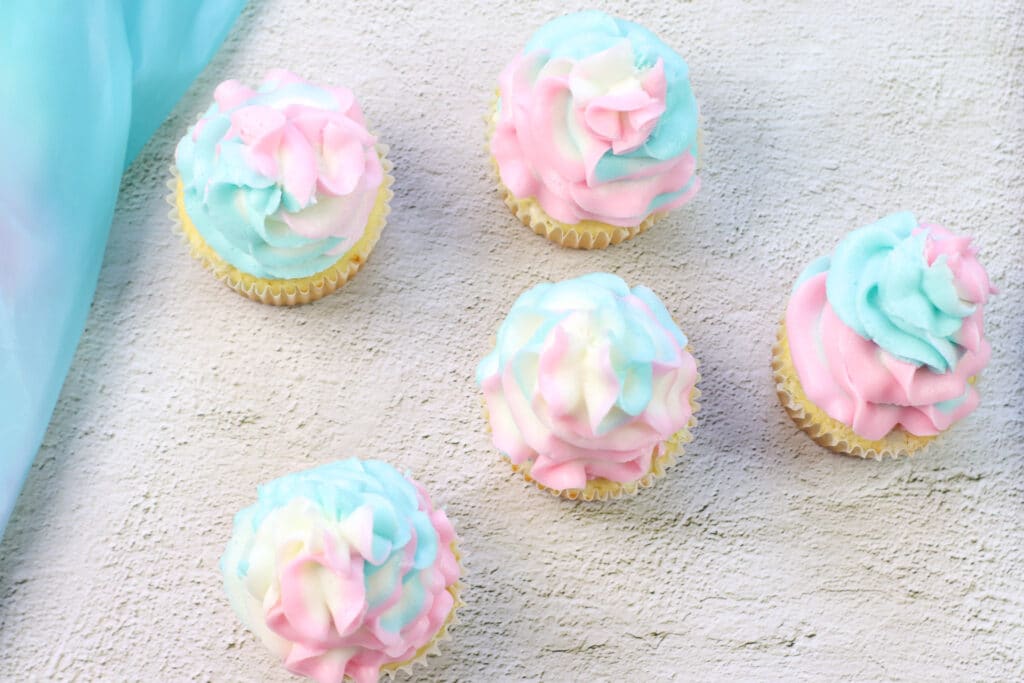 finished cotton candy cupcakes on a raised background