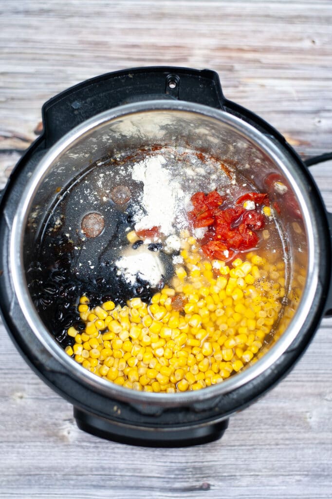broth added to vegetables and beans in pressure cooker