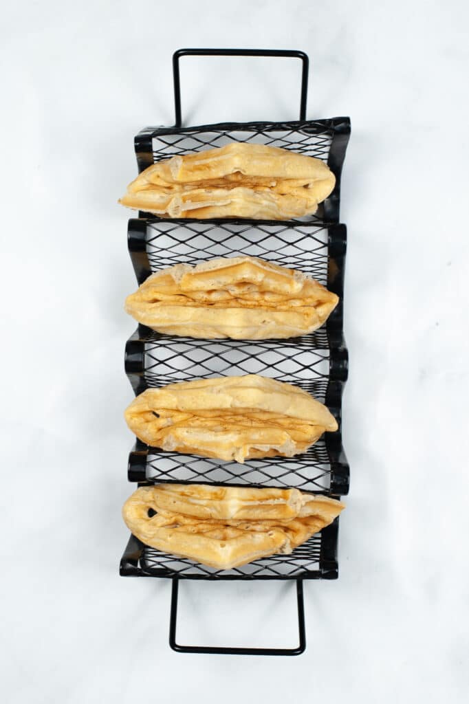 waffles shaped like tacos in a taco stand