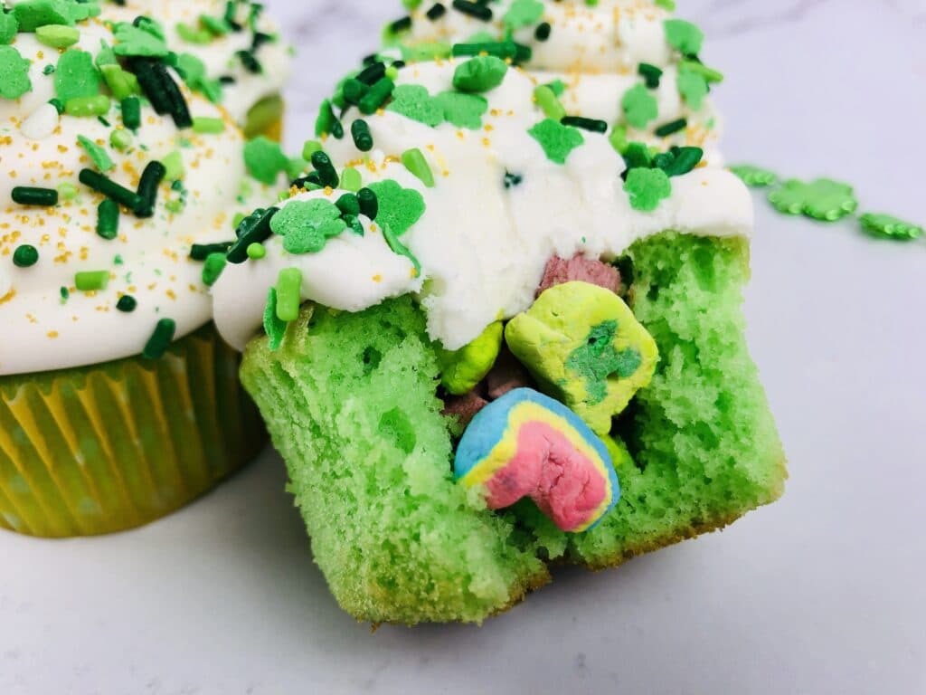 close up of the center of a lucky charms filled cupcake broken open
