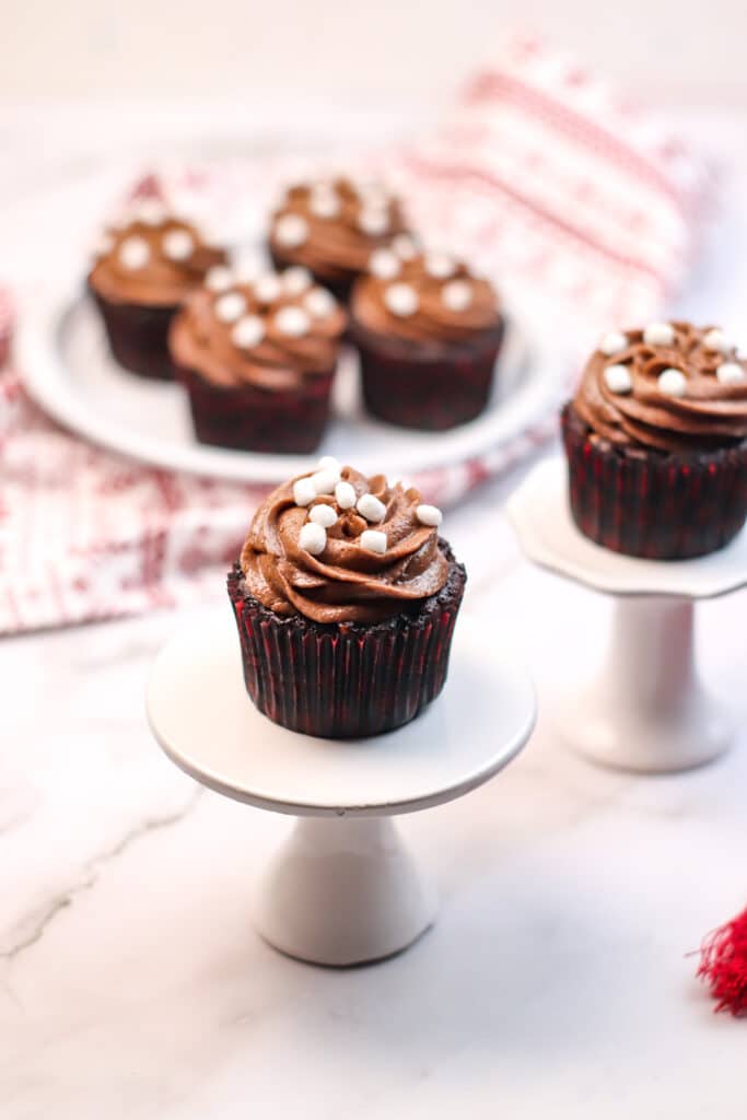 Hot Cocoa Cupcakes on white cake stands