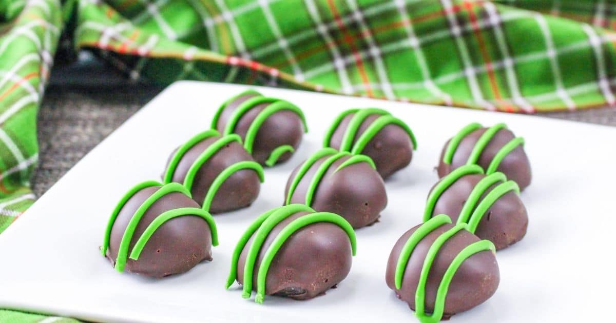rectangle image of nine mint oreo truffles on a white plate