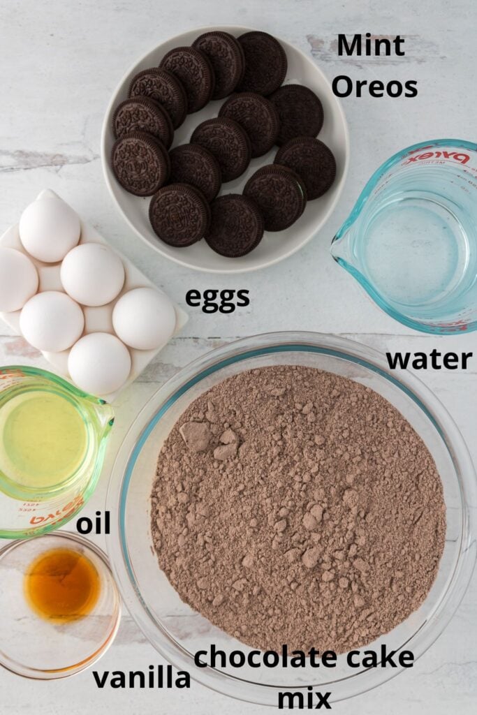 ingredients for Oreo Mint Cake on a white wooden background