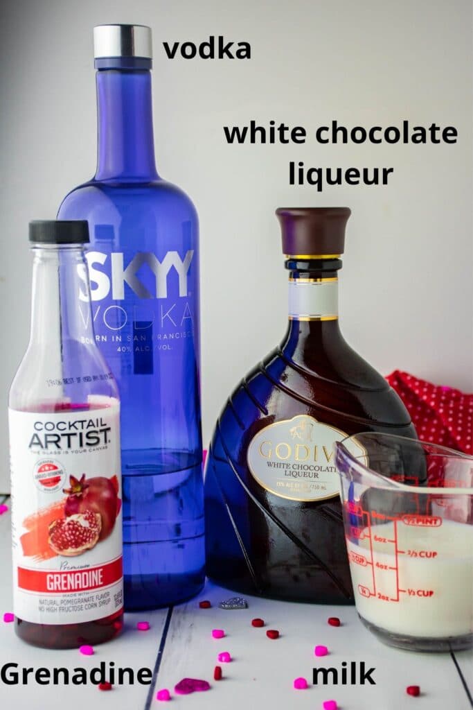 ingredients for red velvet cocktail on a wooden background
