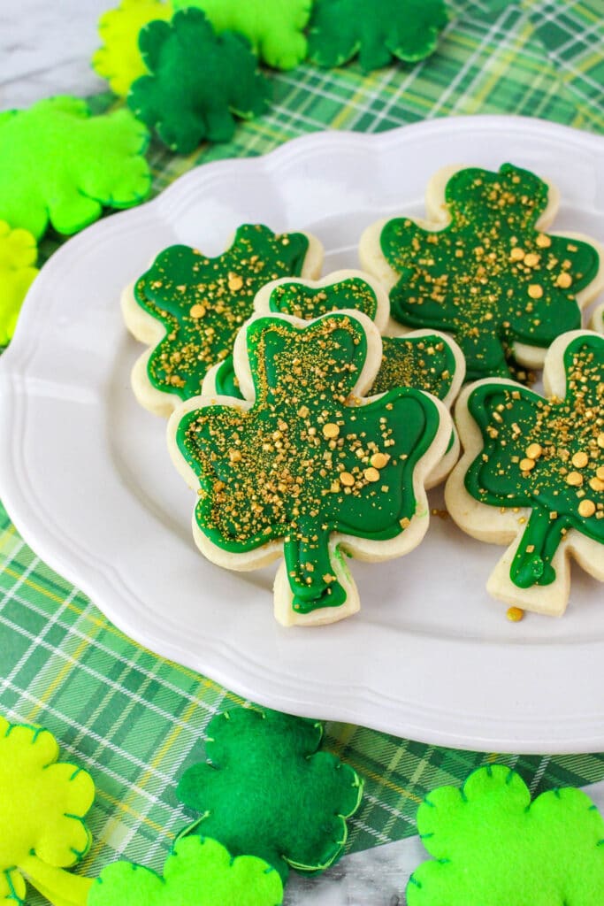 off center image of st. patrick's day sugar cookies on a white plate