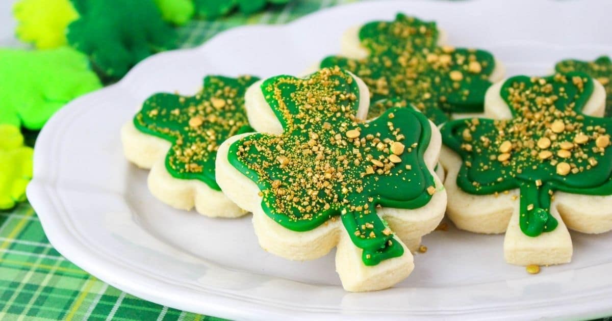 rectangle image of st patrick's day cookies on a white plate