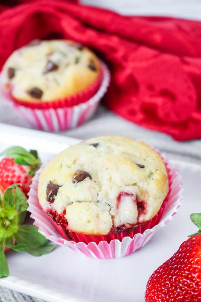 Strawberry Chocolate Chip Muffins on a white plate