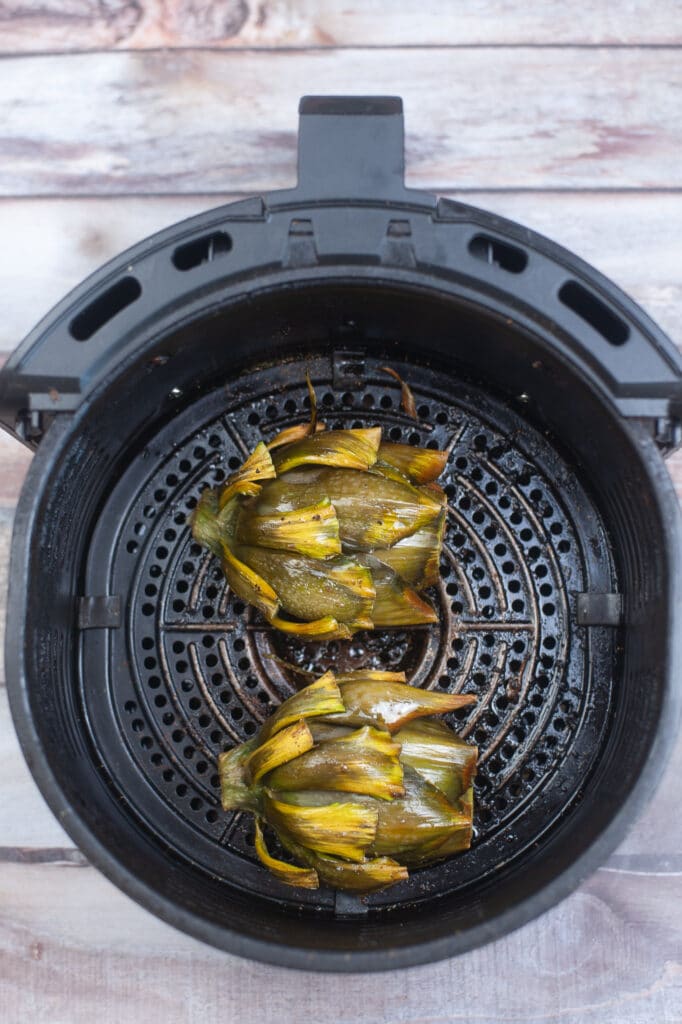 cooked artichokes still in air fryer basket