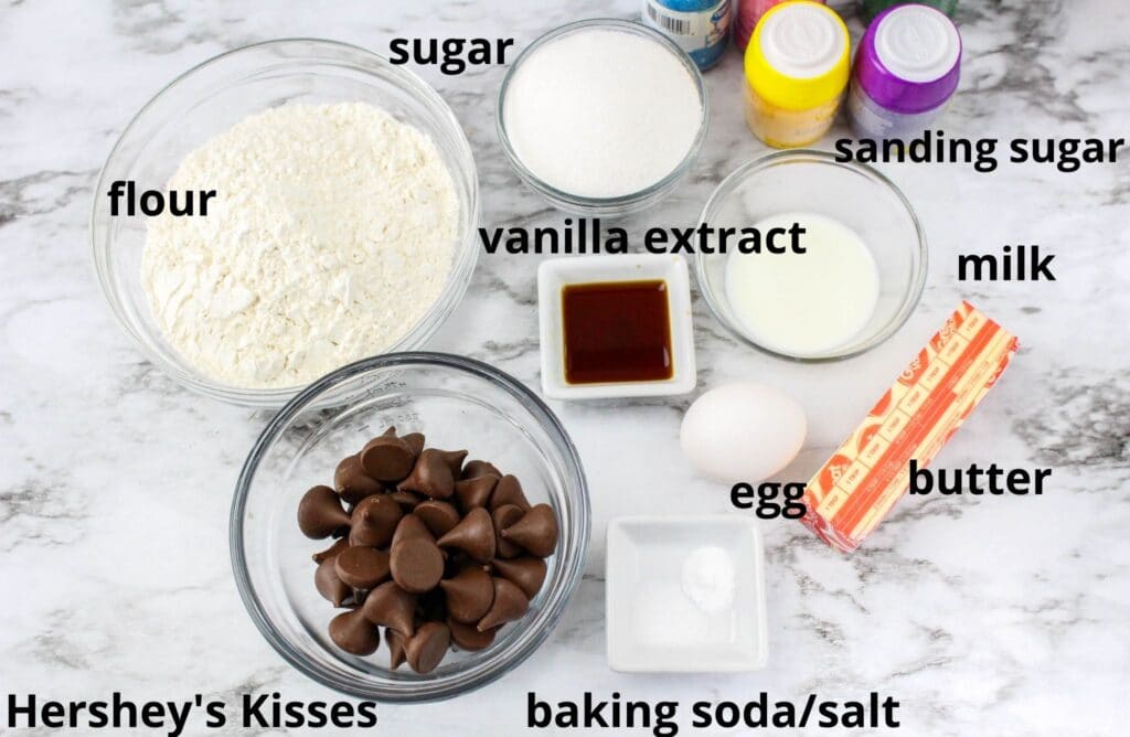 ingredients for easter blossom cookies on a marble counter top with text labeling them
