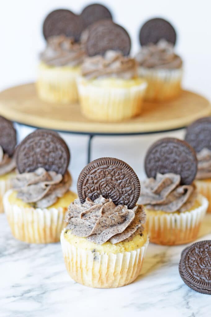 Oreo Cupcakes on a countertop and on a cake stand