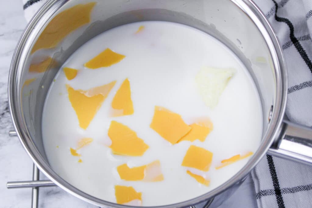 milk, cheese and butter in a sauce pan