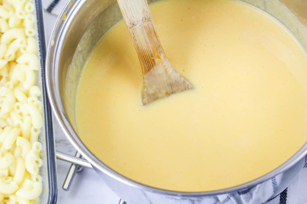 homemade cheese sauce in a stainless steel pan